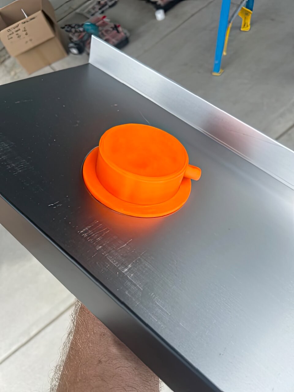 Top hat enclosure on our puck lights, preventing interference with water flow in the underdeck panel.